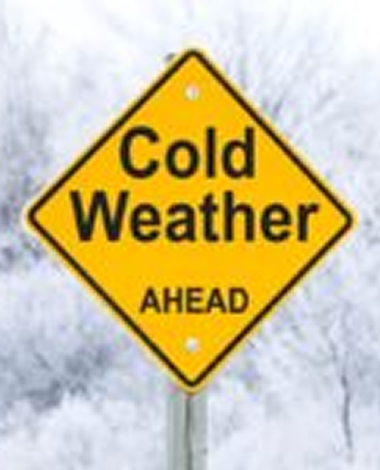Yellow road sign reading 'Cold Weather Ahead' against a snowy background.