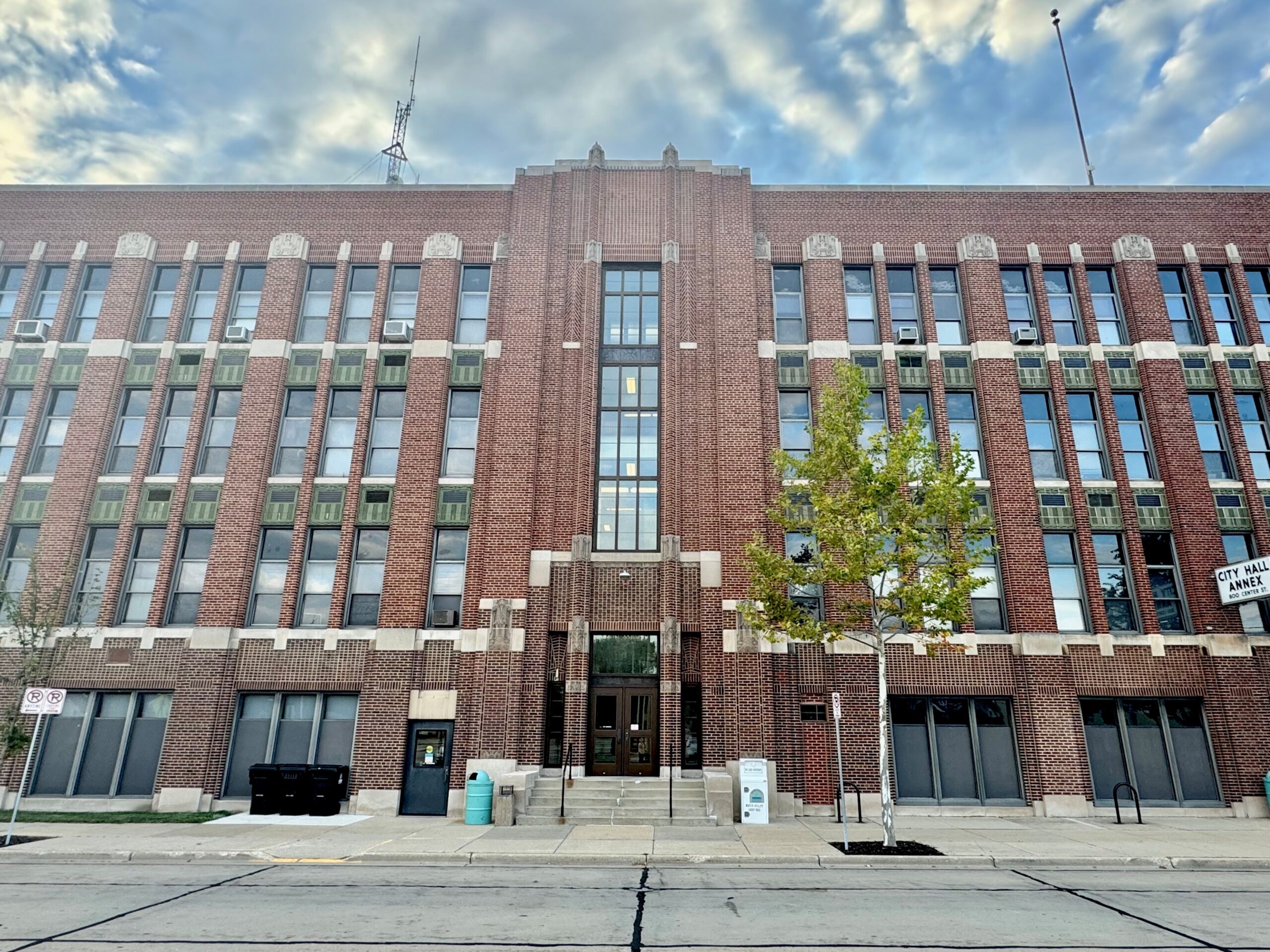 Racine City Hall Annex building exterior with sign indicating location on Center St.