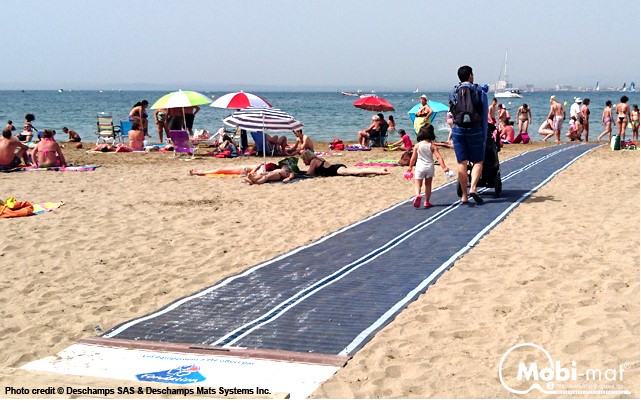 Beach access mat allows wheelchair and stroller users to easily navigate the sandy beach.